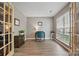Bright office space with wood-look floors, neutral paint, French doors, and a large window at 2856 Huckleberry Hill Dr, Fort Mill, SC 29715