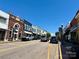 A view of a street in Fort Mill lined with colorful storefronts and businesses at 2856 Huckleberry Hill Dr, Fort Mill, SC 29715