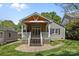 Back porch with a stylish covered porch and a view of the grassy yard at 3019 Sunset Dr, Charlotte, NC 28209