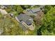 Aerial view of a home's backyard showcasing a stone pathway leading to a covered porch at 3019 Sunset Dr, Charlotte, NC 28209
