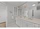 Stylish bathroom featuring a double sink vanity, classic fixtures, and hexagon tile flooring, creating an appealing space at 3019 Sunset Dr, Charlotte, NC 28209