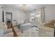 Charming bedroom with hardwood floors, a decorative chandelier, and a colorful rug that adds vibrancy to the space at 3019 Sunset Dr, Charlotte, NC 28209