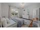 Inviting bedroom with hardwood floors, natural light, and a dresser, creating a relaxing atmosphere at 3019 Sunset Dr, Charlotte, NC 28209