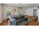 Charming dining room with a rustic table, bench seating, and large windows, perfect for Gathering gatherings at 3019 Sunset Dr, Charlotte, NC 28209