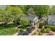 Charming home with well-manicured lawn, mature trees, and gated driveway in a serene neighborhood at 3019 Sunset Dr, Charlotte, NC 28209