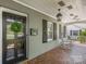 Charming front porch with rocking chairs, brick flooring, and a stylish front door at 3019 Sunset Dr, Charlotte, NC 28209