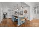 Spacious eat-in kitchen offers a large center island, stainless appliances and hardwood floors at 3019 Sunset Dr, Charlotte, NC 28209