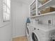 Functional laundry room equipped with modern appliances and ample storage space for convenience at 3019 Sunset Dr, Charlotte, NC 28209