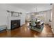 Inviting living room features a fireplace, hardwood floors, and large windows for ample natural light at 3019 Sunset Dr, Charlotte, NC 28209