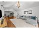 Bright, open-concept living room with hardwood floors, a modern kitchen, vaulted ceilings and stylish furnishings at 3019 Sunset Dr, Charlotte, NC 28209