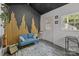 This bright, contemporary room with soundproofing features an accent wall and a comfortable blue sofa at 3019 Sunset Dr, Charlotte, NC 28209