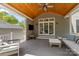 Enjoy the outdoors in this spacious covered patio with comfortable seating and a mounted TV at 3019 Sunset Dr, Charlotte, NC 28209