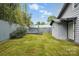 Enjoy a private backyard enclosed by a wooden fence, featuring an elevated deck and lush lawn at 313 Mayflower Ave, Cramerton, NC 28032
