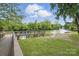Scenic dock view with serene river and lush greenery, perfect for relaxation and enjoying waterfront activities at 313 Mayflower Ave, Cramerton, NC 28032