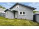 Cozy home with gray siding and trimmed windows, showcasing its tidy front lawn at 313 Mayflower Ave, Cramerton, NC 28032
