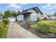 Quaint home featuring a detached garage, charming facade, and inviting landscaping at 313 Mayflower Ave, Cramerton, NC 28032