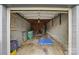 Inside the garage featuring concrete block walls, wooden supports, and an open ceiling at 313 Mayflower Ave, Cramerton, NC 28032