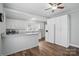 Bright eat-in kitchen with white cabinets, modern appliances, and hardwood floors at 313 Mayflower Ave, Cramerton, NC 28032