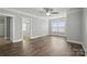 Spacious living room featuring hardwood floors, natural light, and neutral paint at 313 Mayflower Ave, Cramerton, NC 28032