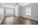 Bright living room featuring hardwood floors, natural light and view into entry at 313 Mayflower Ave, Cramerton, NC 28032