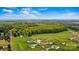 Expansive aerial view of a home on a large lot with lush greenery and blue sky at 3659 Kimber Ln, Sherrills Ford, NC 28673