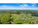 Wide aerial perspective of a home site, displaying the neighborhood, surrounding landscape, and picturesque sky at 3659 Kimber Ln, Sherrills Ford, NC 28673
