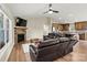 Inviting living room with stone fireplace, wood floors, and comfortable leather furniture at 3659 Kimber Ln, Sherrills Ford, NC 28673