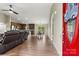 Open floor plan combines living, dining, and kitchen areas with wood floors and modern lighting at 3659 Kimber Ln, Sherrills Ford, NC 28673