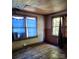 This bedroom has broken curtains, wood floors, and windows at 40 Ranlo Ave, Gastonia, NC 28054