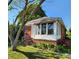 Charming single-story home featuring brick accents, a sunroom, and a well-maintained lawn and garden at 40 Ranlo Ave, Gastonia, NC 28054