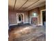 A spacious living room features wood floors, a brick fireplace, and several open doorways at 40 Ranlo Ave, Gastonia, NC 28054