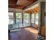 A bright sunroom with terracotta floors and multiple windows, perfect for enjoying natural light at 40 Ranlo Ave, Gastonia, NC 28054