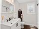Bright bathroom with a white vanity, black hardware, and a contemporary design at 402 Sidney Johnson St, Fort Mill, SC 29715