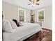 Cozy bedroom with natural light from two windows, ceiling fan and stylish rug at 402 Sidney Johnson St, Fort Mill, SC 29715