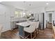 Modern kitchen with stainless appliances, white cabinetry, island with barstool seating at 402 Sidney Johnson St, Fort Mill, SC 29715