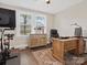 Home office featuring a wooden desk, ergonomic chair, and lots of natural light at 402 Sidney Johnson St, Fort Mill, SC 29715