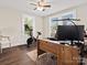 Functional home office setup with a wooden desk, ergonomic chair, and natural light at 402 Sidney Johnson St, Fort Mill, SC 29715