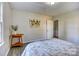 Bedroom with a bed, an area rug, a side table and a doorway to another room at 430 Coolidge Ave, Statesville, NC 28677