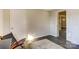 Bedroom featuring hardwood floors, multiple doors, and a chair at 430 Coolidge Ave, Statesville, NC 28677