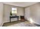 Bedroom showcasing hardwood floors, a window, console table and a chair at 430 Coolidge Ave, Statesville, NC 28677