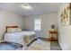 Bedroom with a bed, area rug and a side table at 430 Coolidge Ave, Statesville, NC 28677