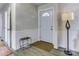 Welcoming foyer featuring neutral walls, stylish wainscoting and durable laminate flooring at 430 Coolidge Ave, Statesville, NC 28677
