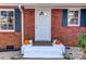 Inviting front entry featuring a decorative brick facade and freshly painted steps at 430 Coolidge Ave, Statesville, NC 28677