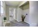 Hallway with gray walls and gray floors featuring a door at the end at 430 Coolidge Ave, Statesville, NC 28677