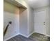 Hallway with gray walls, white trim, and a bright white door at 430 Coolidge Ave, Statesville, NC 28677