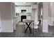 Eat-in kitchen with white cabinets, stainless steel appliances, and small round table at 430 Coolidge Ave, Statesville, NC 28677