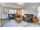 Bright living room featuring modern sofas, neutral decor, and stylish laminate flooring at 430 Coolidge Ave, Statesville, NC 28677
