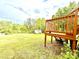 Large backyard deck offers outdoor enjoyment with a spacious yard and a shed in the distance at 45 Oak St, Great Falls, SC 29055