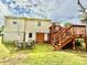 Backyard view with outdoor seating area, wooden deck and stairs at 45 Oak St, Great Falls, SC 29055