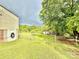 View of backyard featuring chain link fence and lots of space with partial view of house at 45 Oak St, Great Falls, SC 29055